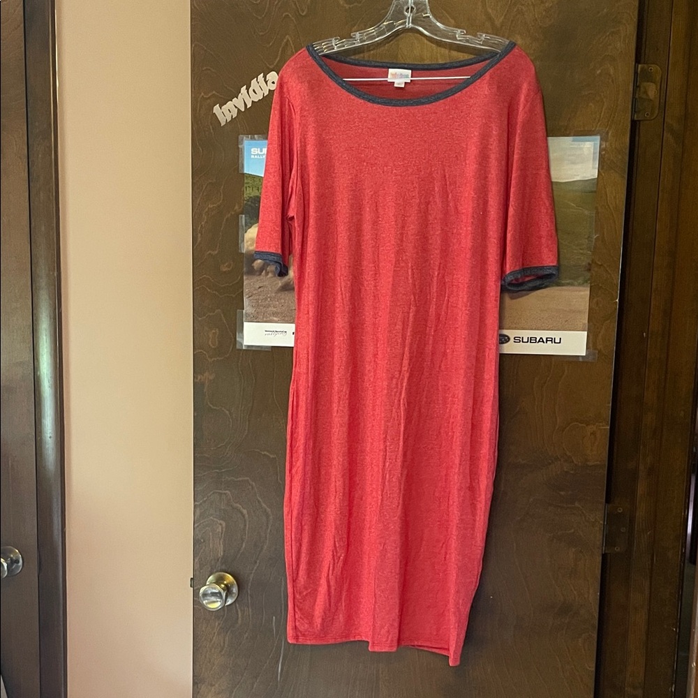 LuLaRoe Julia Dress in a beautiful coral to add a punch of fun to any occasion